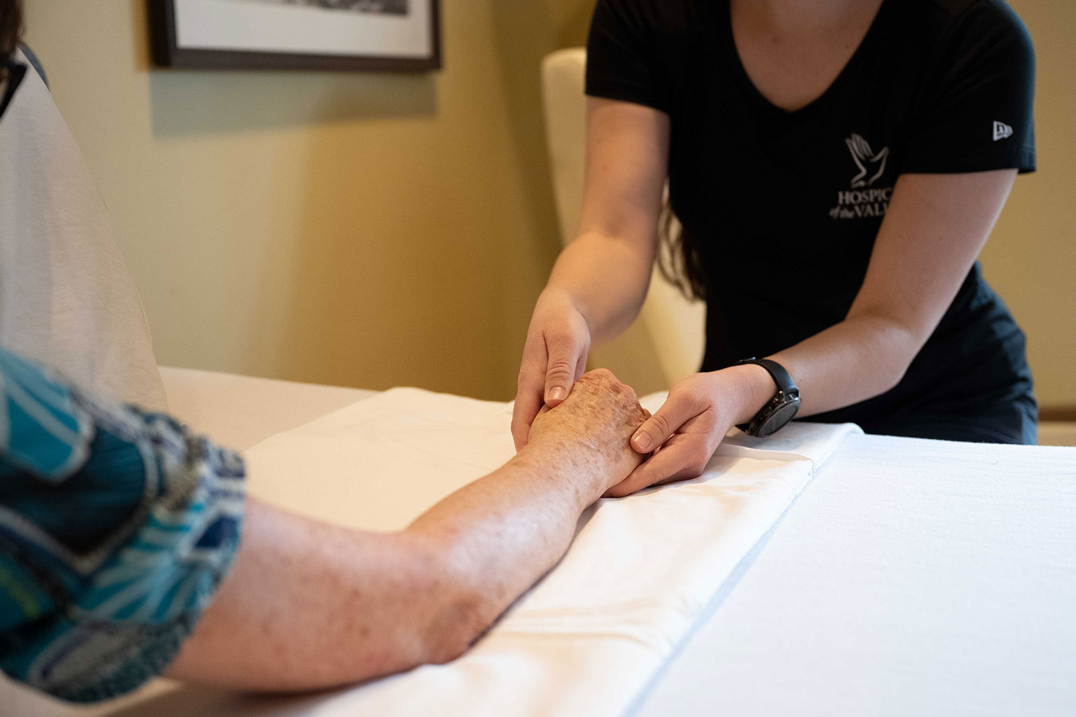 Massage therapist massage patients arm