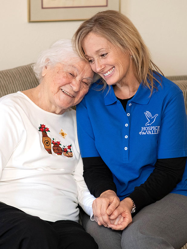 Loving nurse hold hands with patient